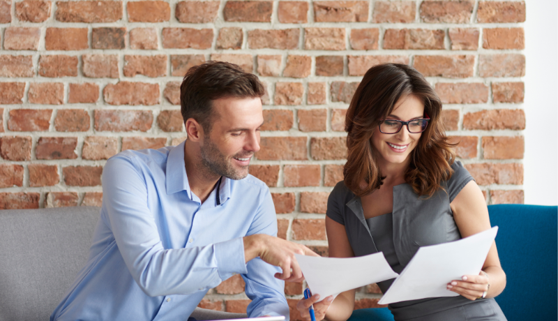 people smiling in corporate meeting