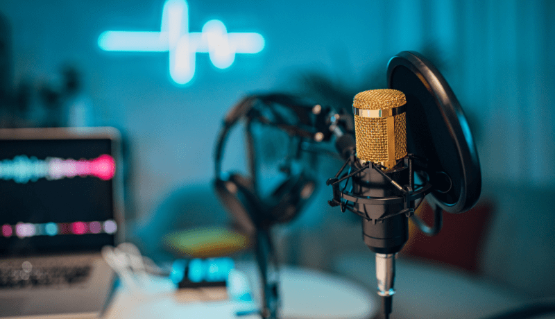 podcast recording studio with a microphone in the foreground